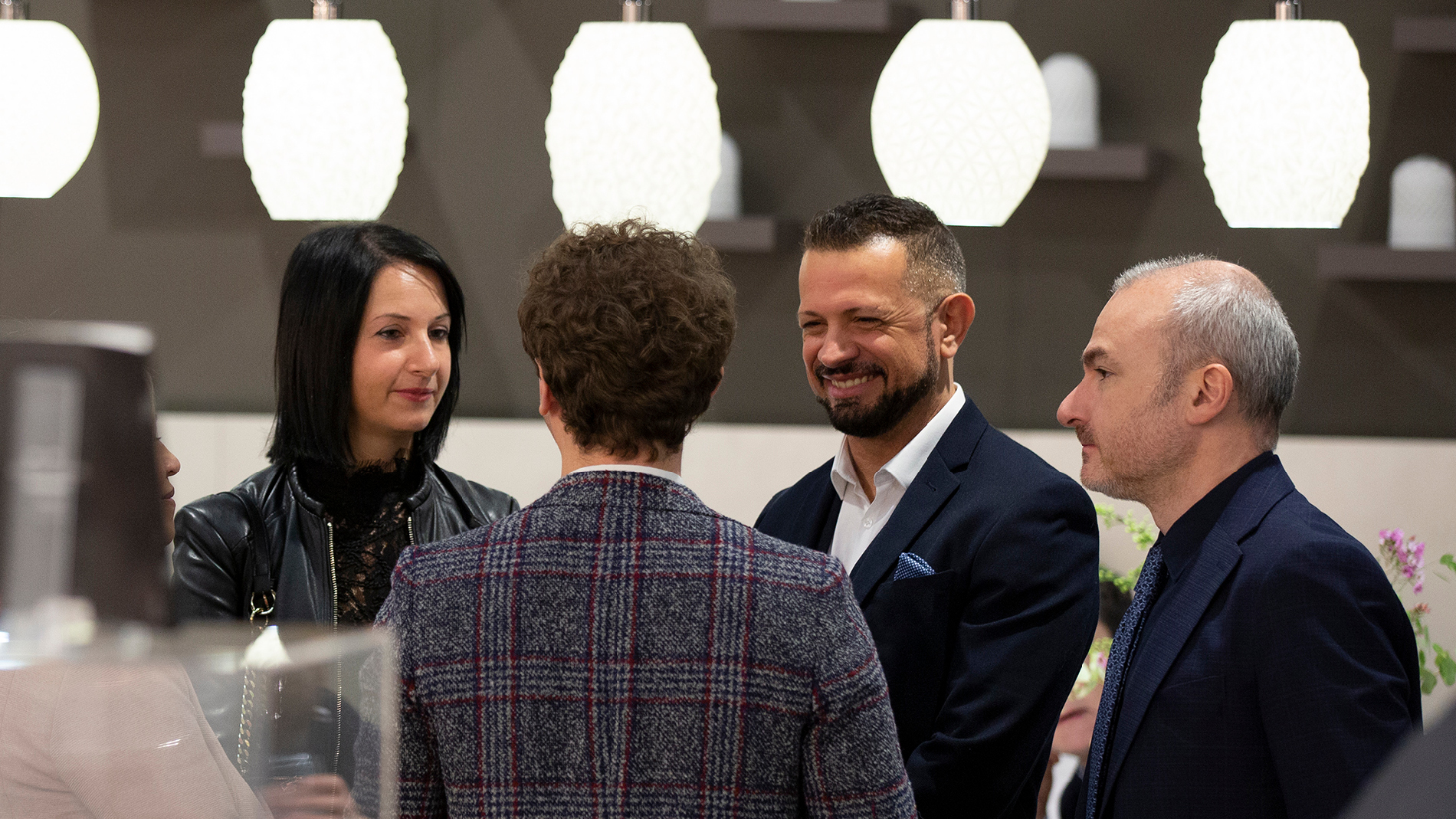 People in conversation at Ambiente