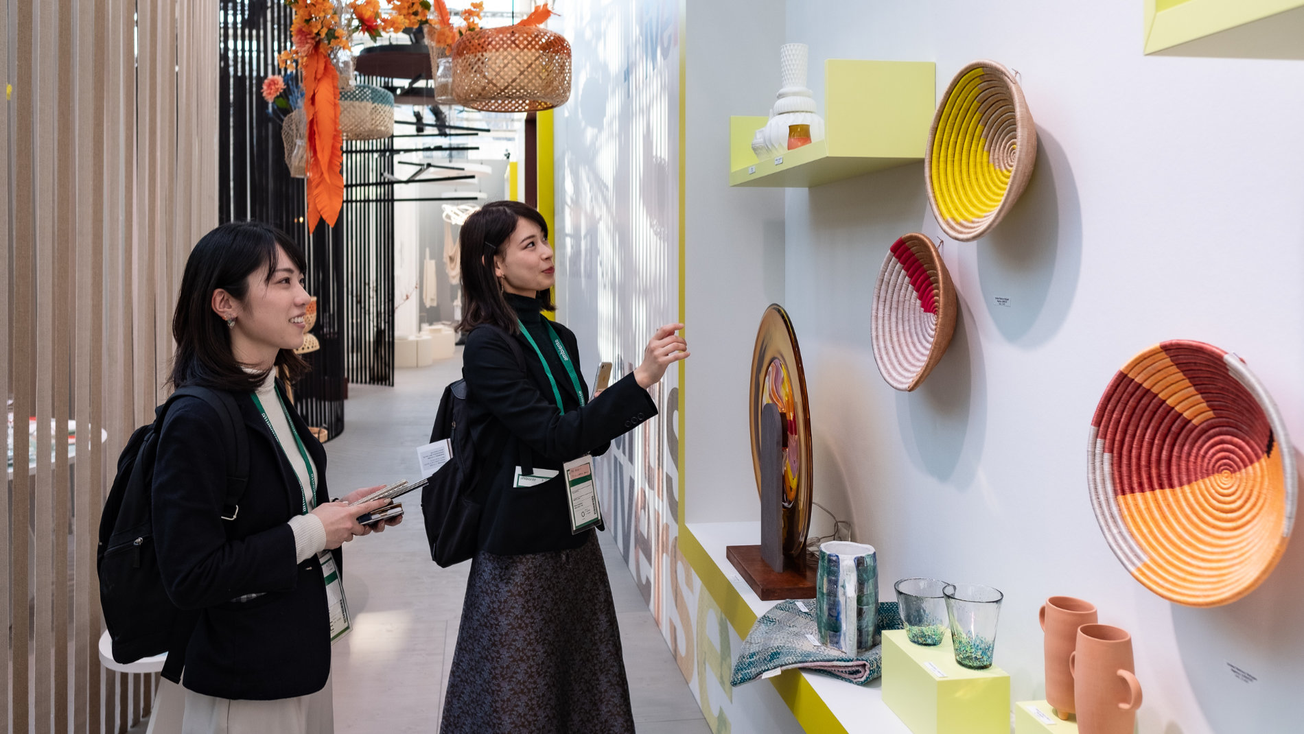 2 Asian women at the Ambiente trend show