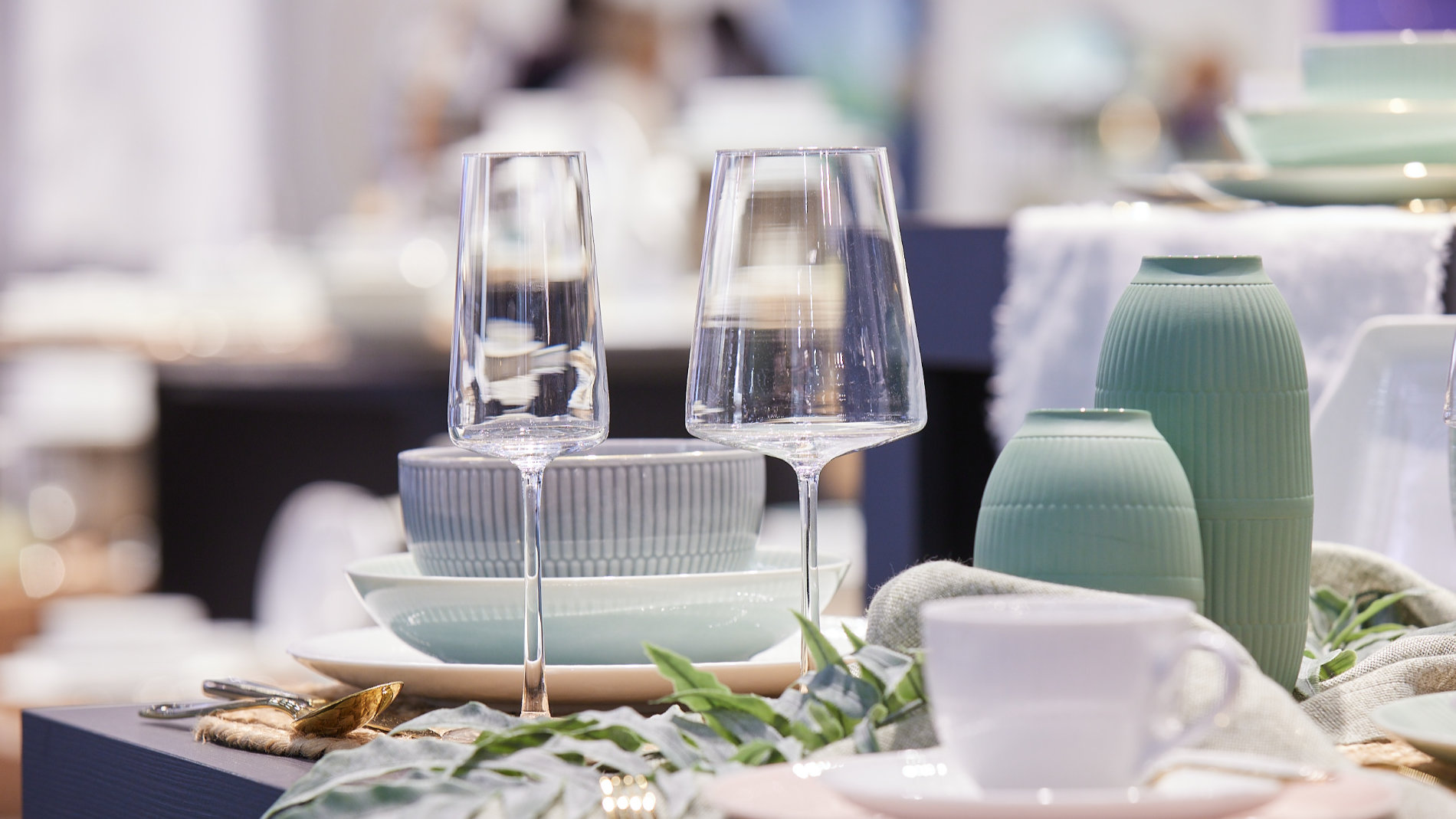 Table set with plates, cups and wine glasses at the Ambiente